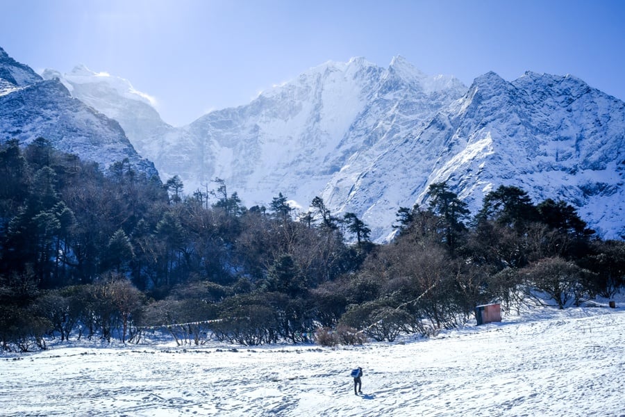Hiker walking on the snow near Tengboche on the EBC Trek in Nepal